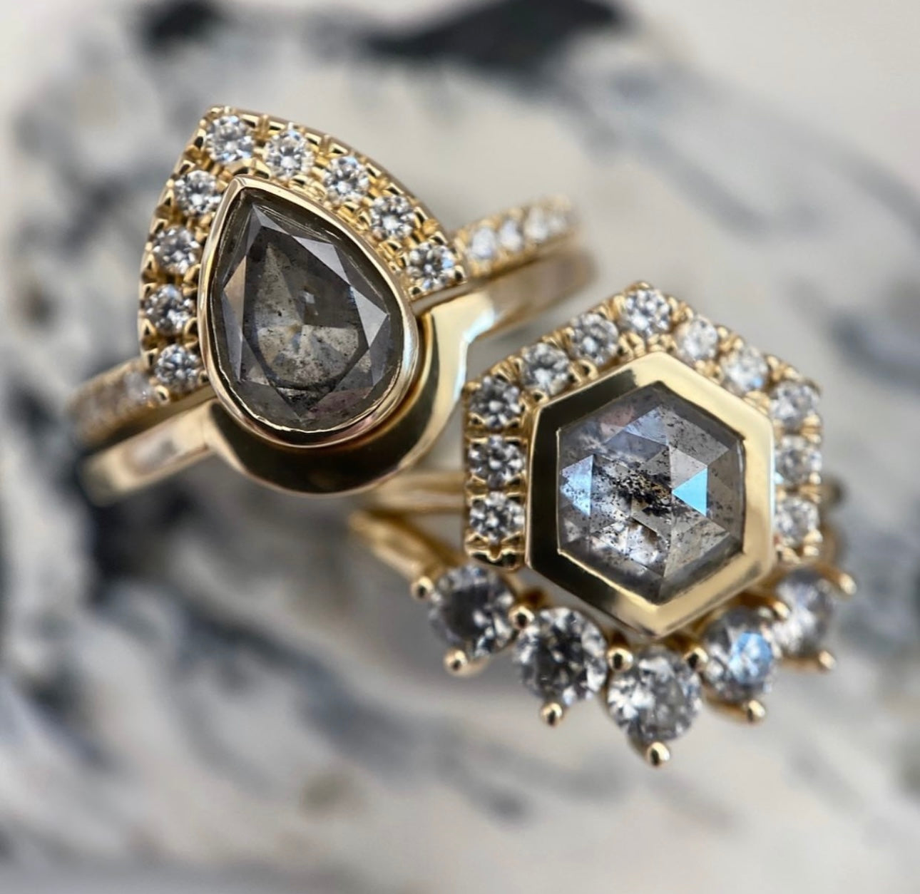 Gold rings in blue and black stones with diamonds