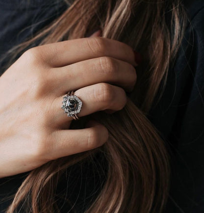 Black stone ring on a woman's hand